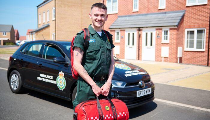 EEAST staff member in front of a roving car with equipment